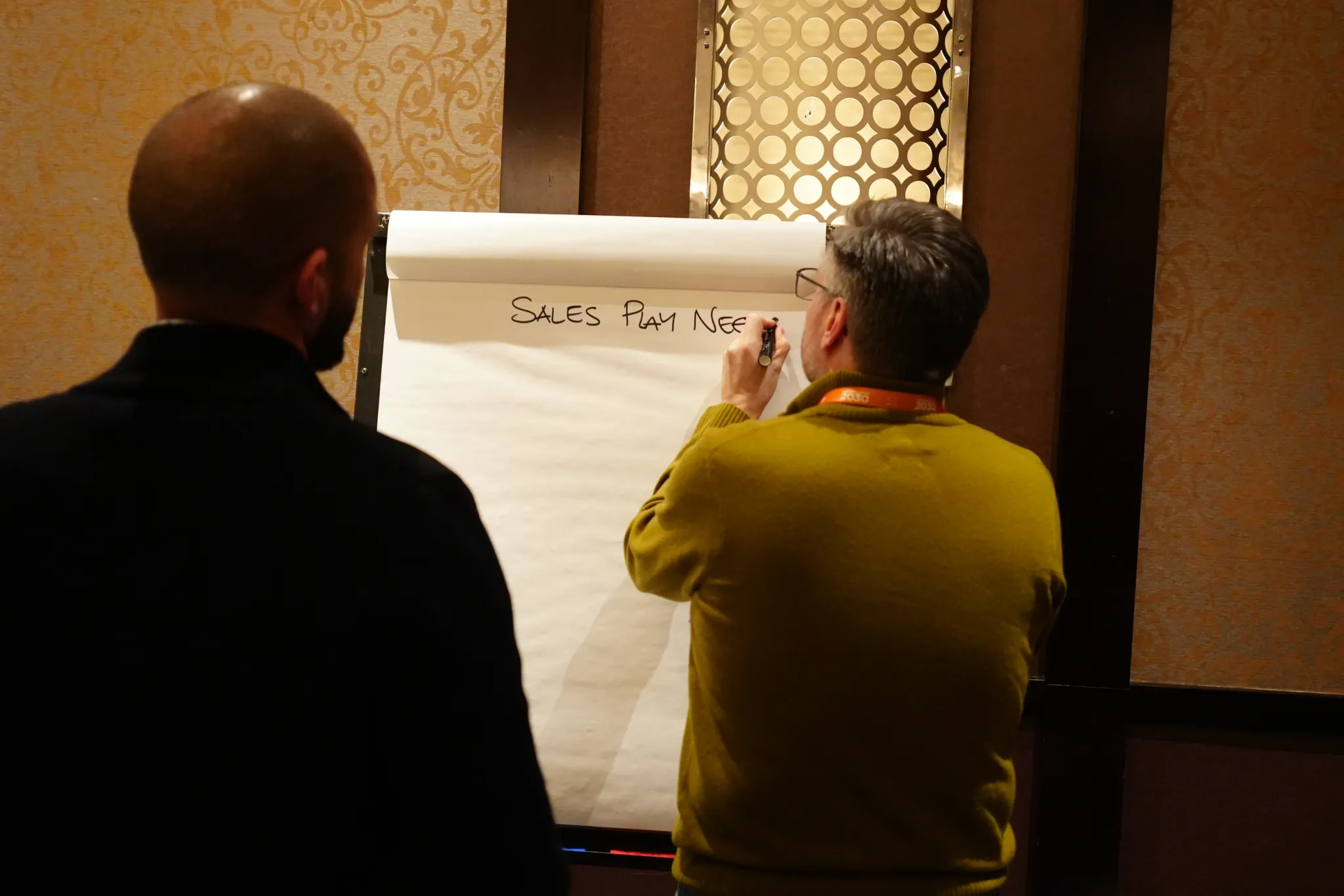 Couchbase Company Kickoff attendees collaborating on Kalua Messaging worksheets