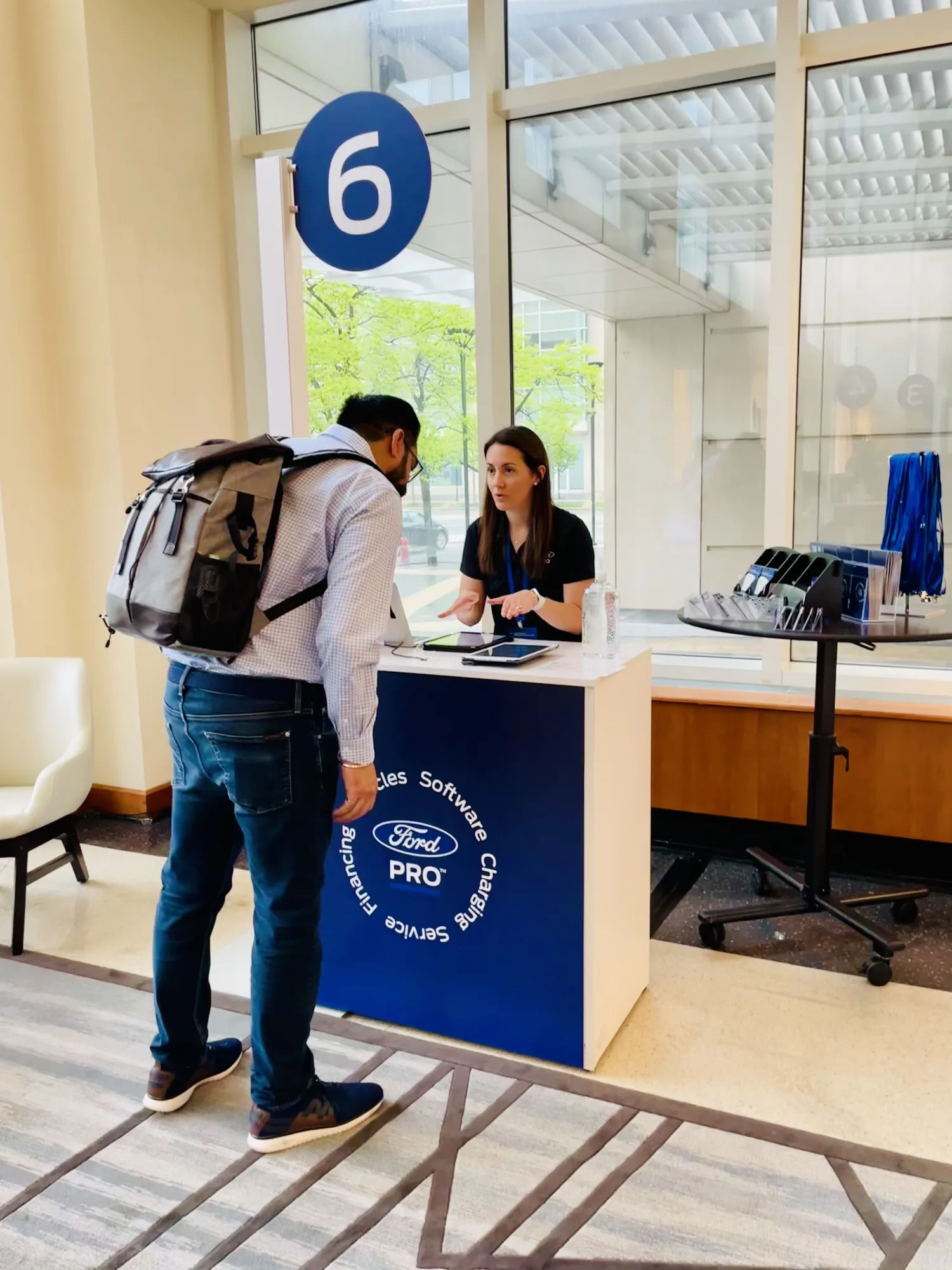 Attendee being assisted at a Ford Pro staffed kiosk
