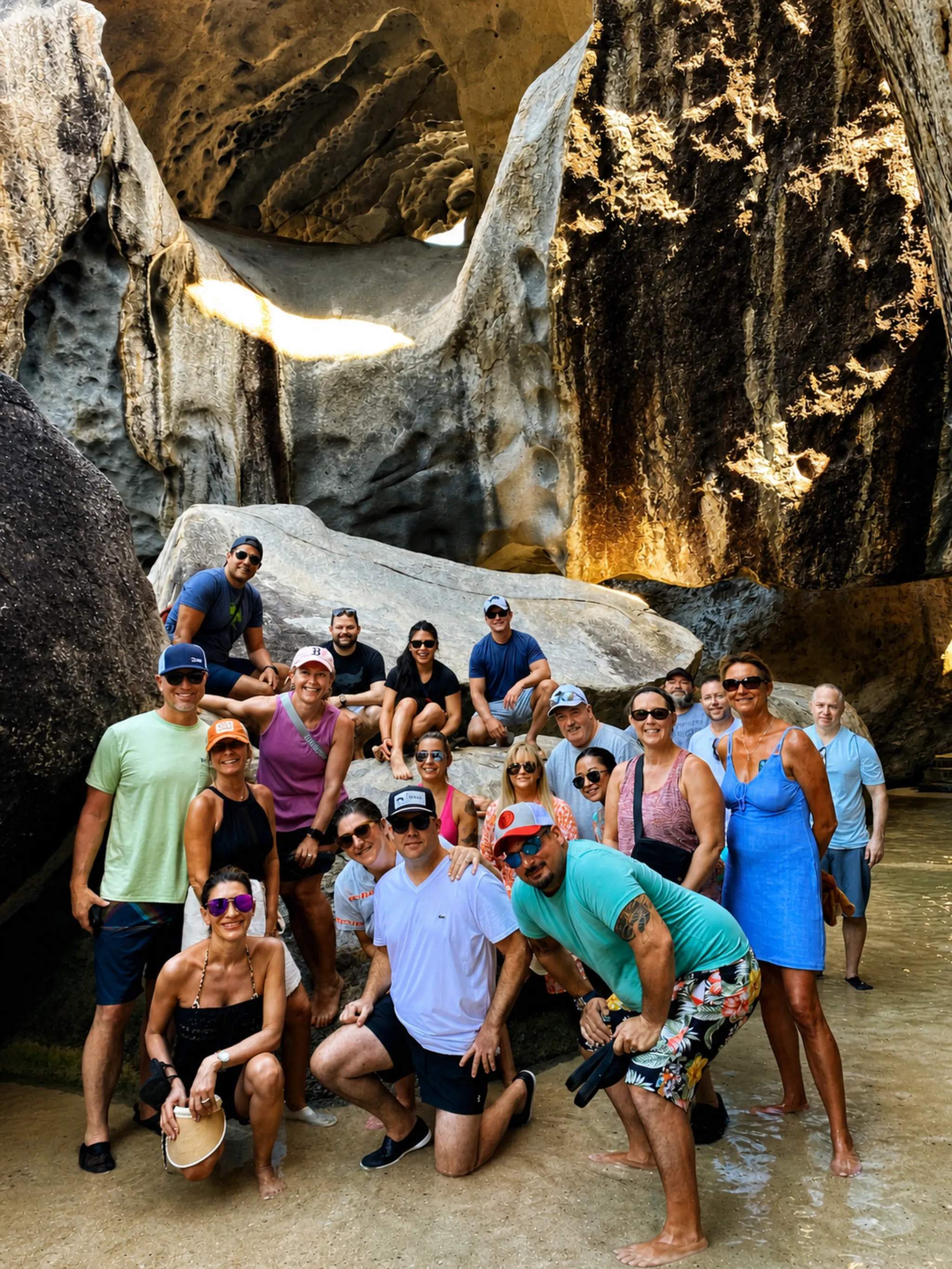 Reach for the Beach group photo inside The Baths granite rock formations on Virgin Gorda