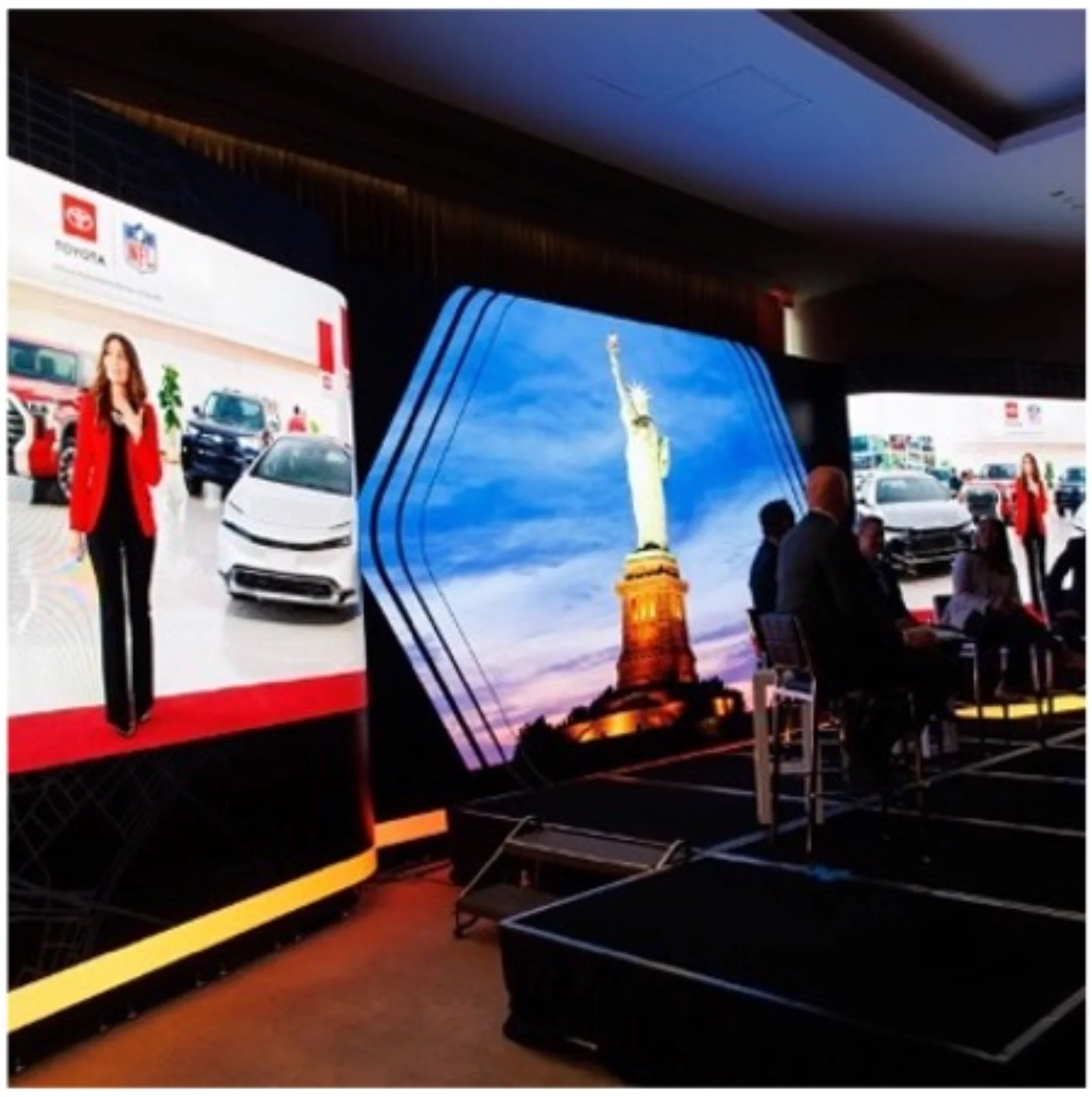 Toyota dealer meeting speaker on stage beside a 'The Seal Bell' on-screen graphic