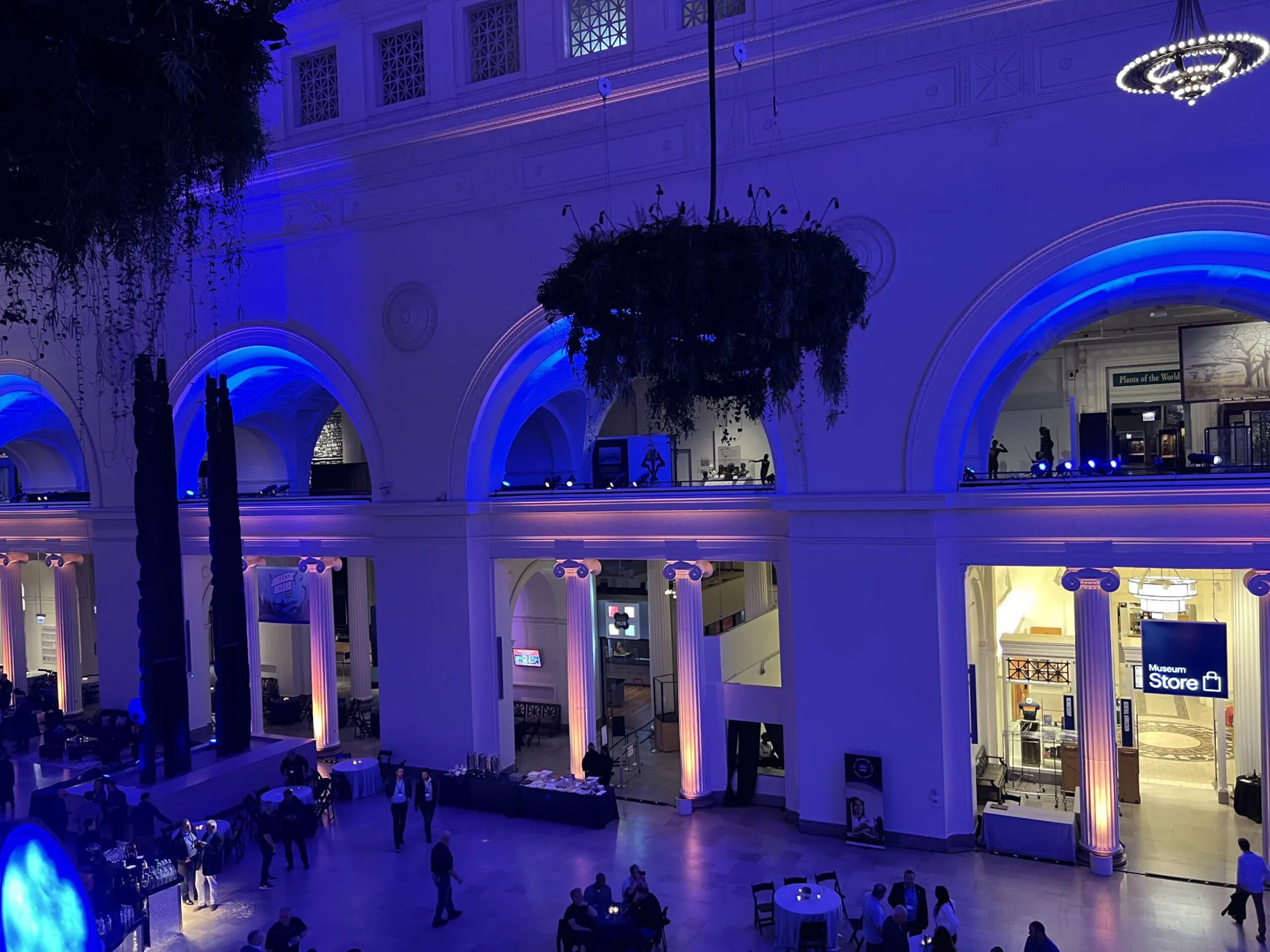 Blue-uplit arched balconies inside the Ford Pro venue